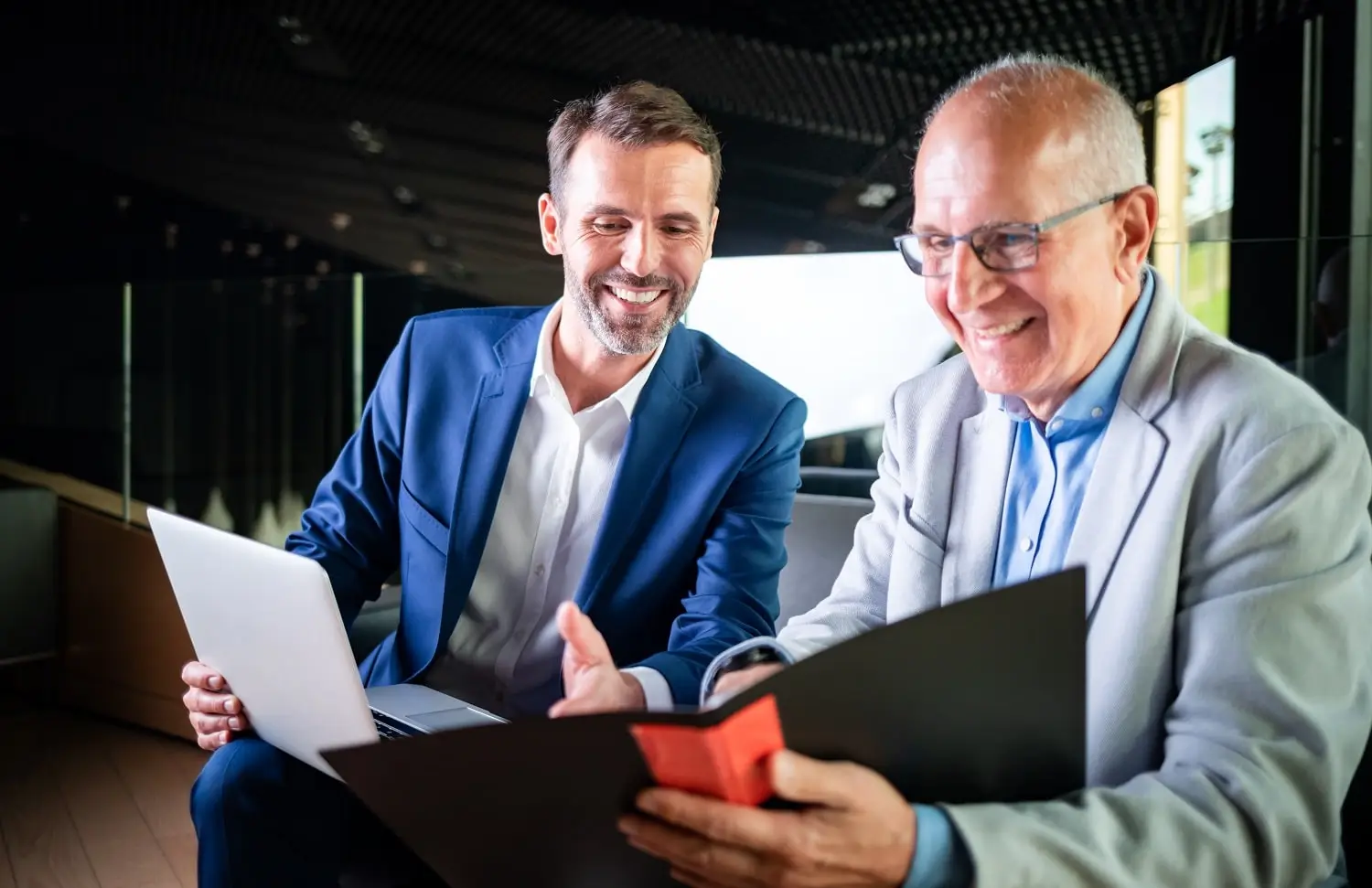 Photo of a financial advisor meeting with a client.