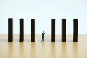 Image of person walking through open barrier.