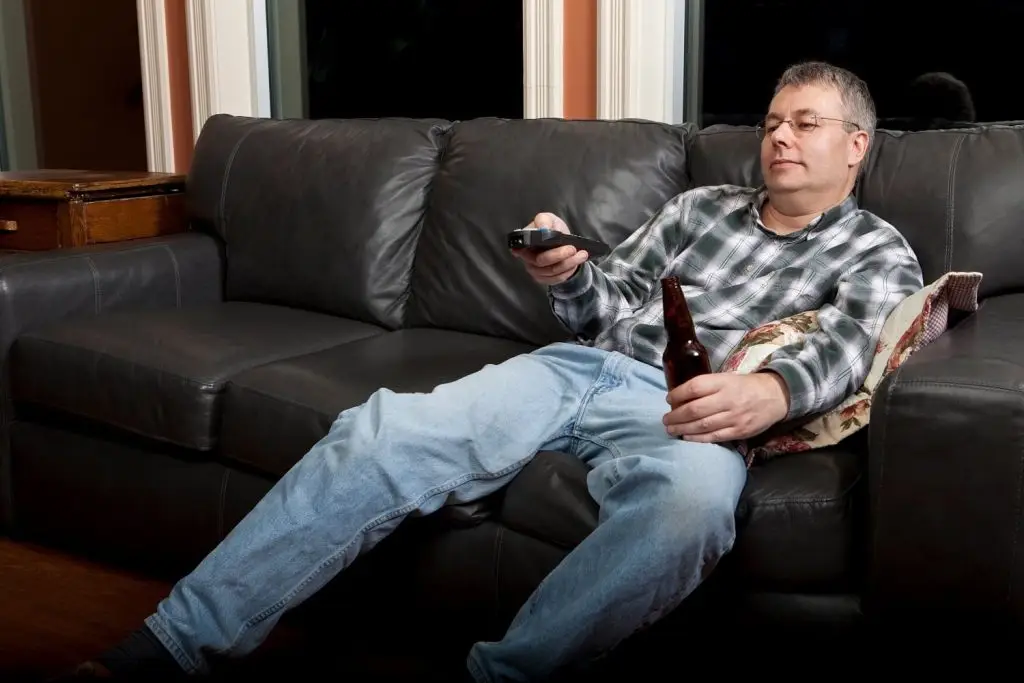 Photo of older man watching television.
