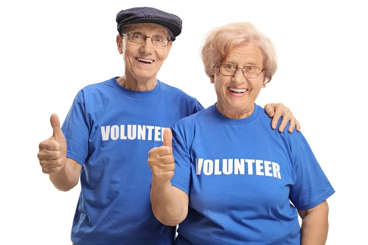 Photo of two older volunteers.