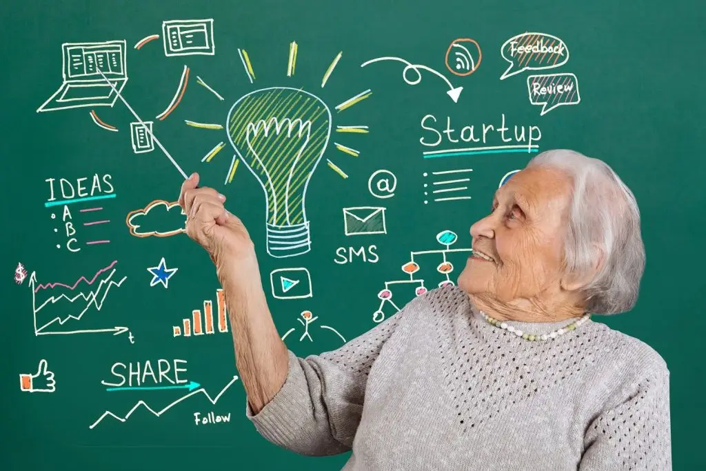 Older woman explaining a diagram.