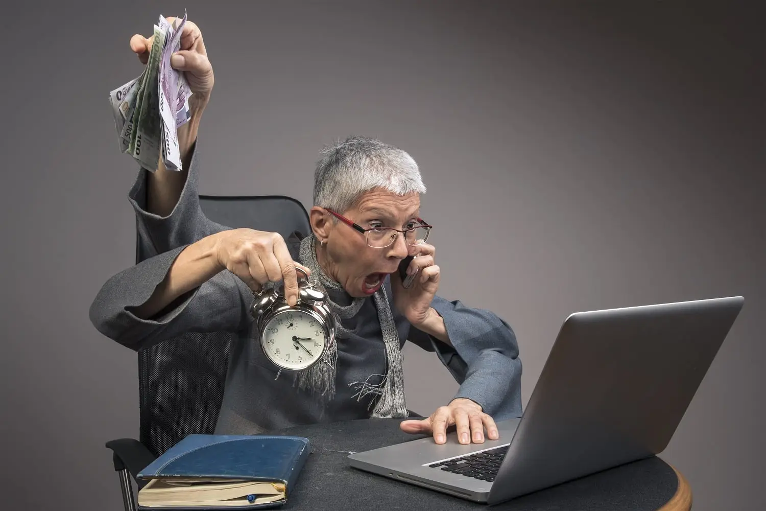 Photo of an older woman multitasking.