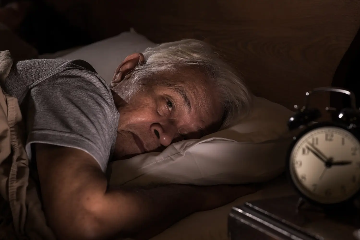 Older man having trouble sleeping.