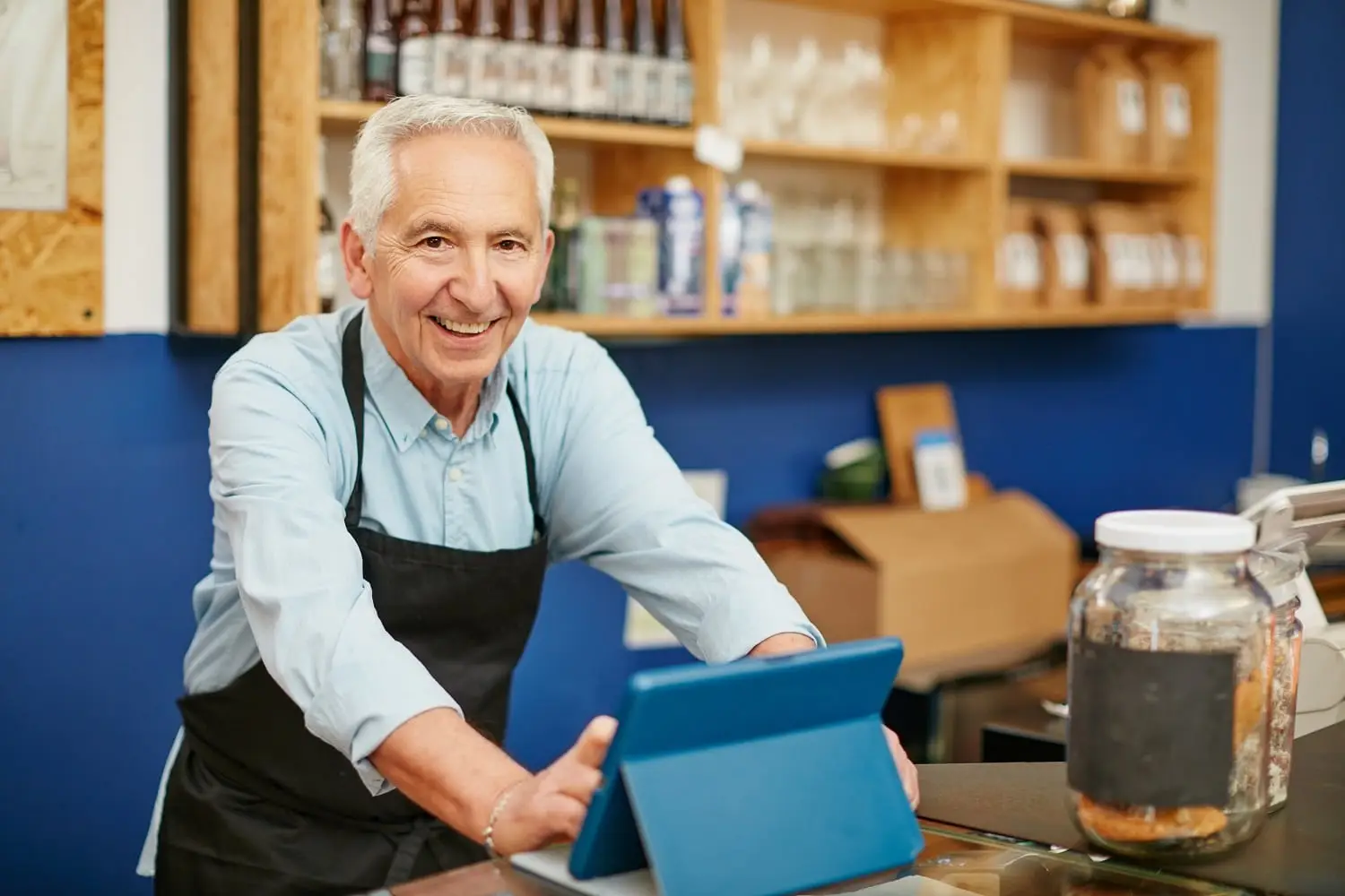 Photo of an older person working in a store.