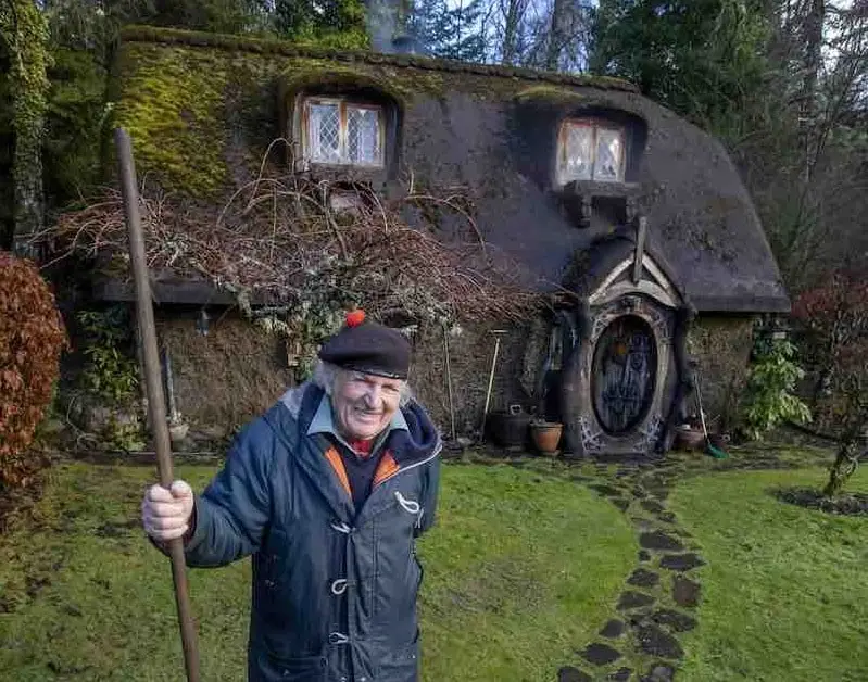 Photo of Stuart Grant in front of his Hobbit house. Photo appeared at SWNS.