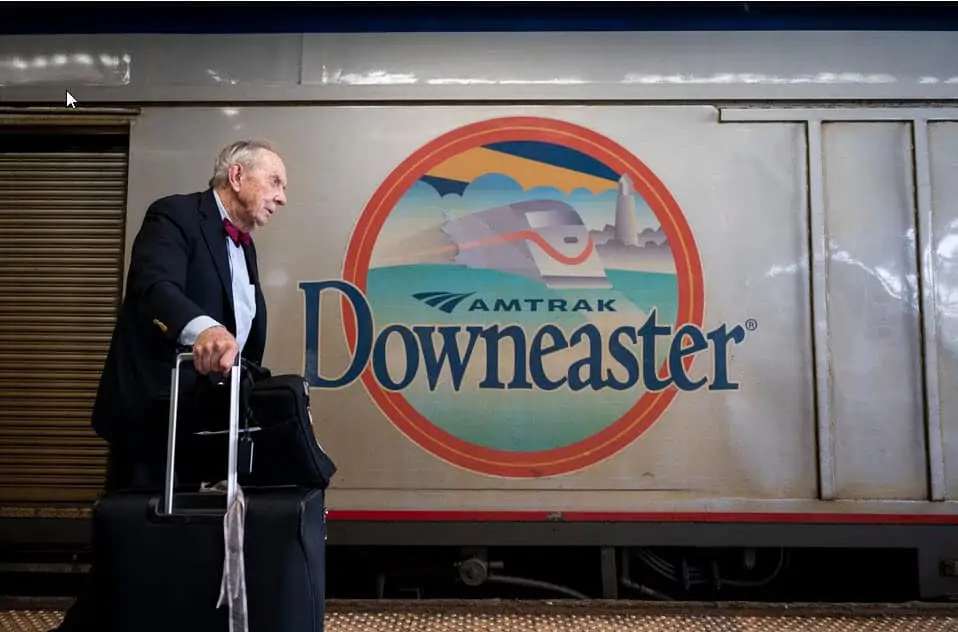 Nat Reed by Amtrak's Downeaster railcar - Photo by Vincent Alban for the Boston Globe