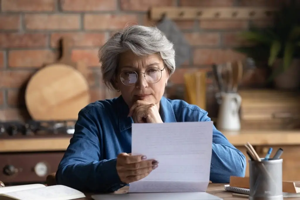 Photo of an older woman pondering a life plan.