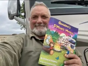 Photo of Richard Duhaime with his book, "Grandpa's S'moresmobile.