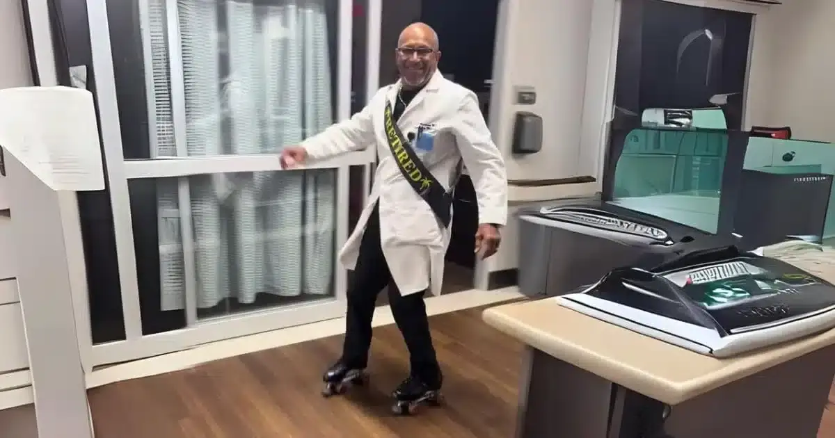 Photo of Dr. Phil Masterson roller-skating around the emergency room on the day he retired.
