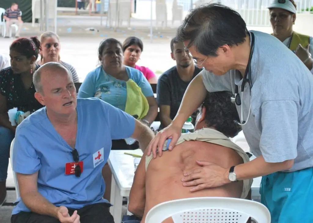 Photo of Jeff Crider, left, interprets for Dr. Kenneth Chan during a mission trip to Estelí, Nicaragua.