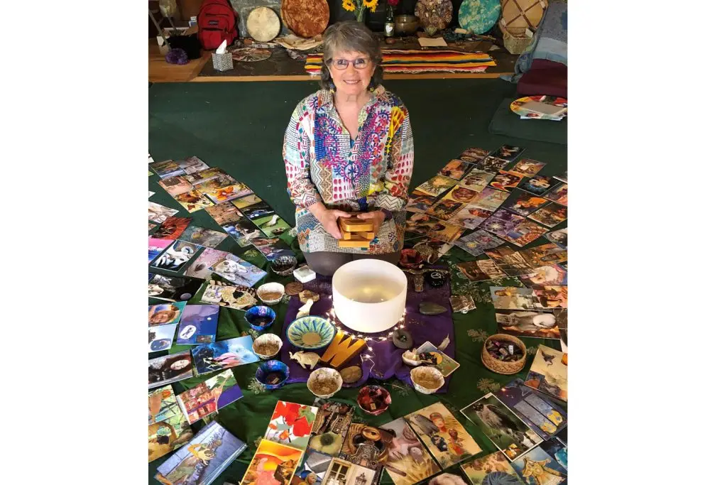 Glenda Goodrich surrounded by her SoulCollage materials.