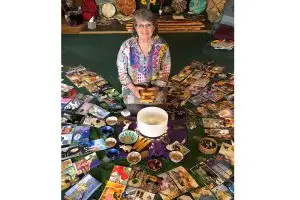 Glenda Goodrich surrounded by her SoulCollage materials.
