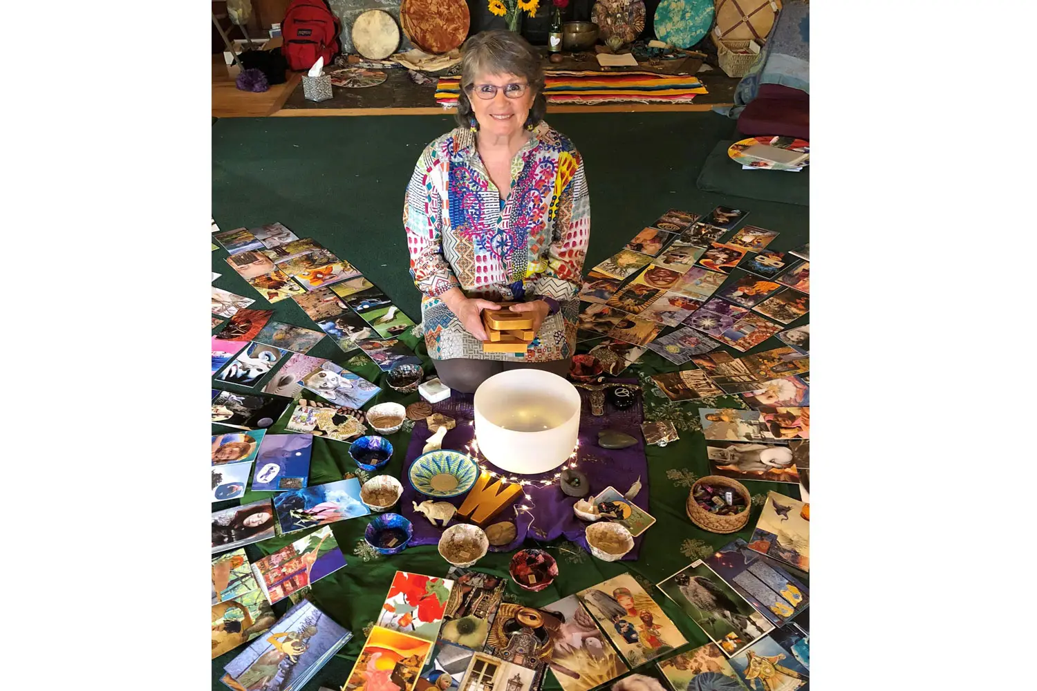 Glenda Goodrich surrounded by her SoulCollage materials.